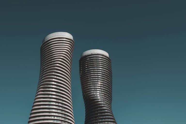 Aerial view of Mississauga skyline featuring modern condos, Square One Shopping Centre, and Lake Ontario shoreline.