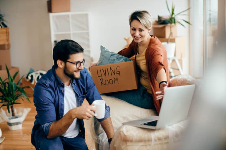 GTA homebuyer reviewing property checklist with real estate agent | Young couple holding keys to their new GTA starter home | Toronto area residential street with diverse housing options